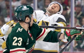 Brayden McNabb of Vegas reacts to a high stick from Marco Rossi of the Wild early in Thursday's game at Xcel Energy Center. Rossi got a double-minor a