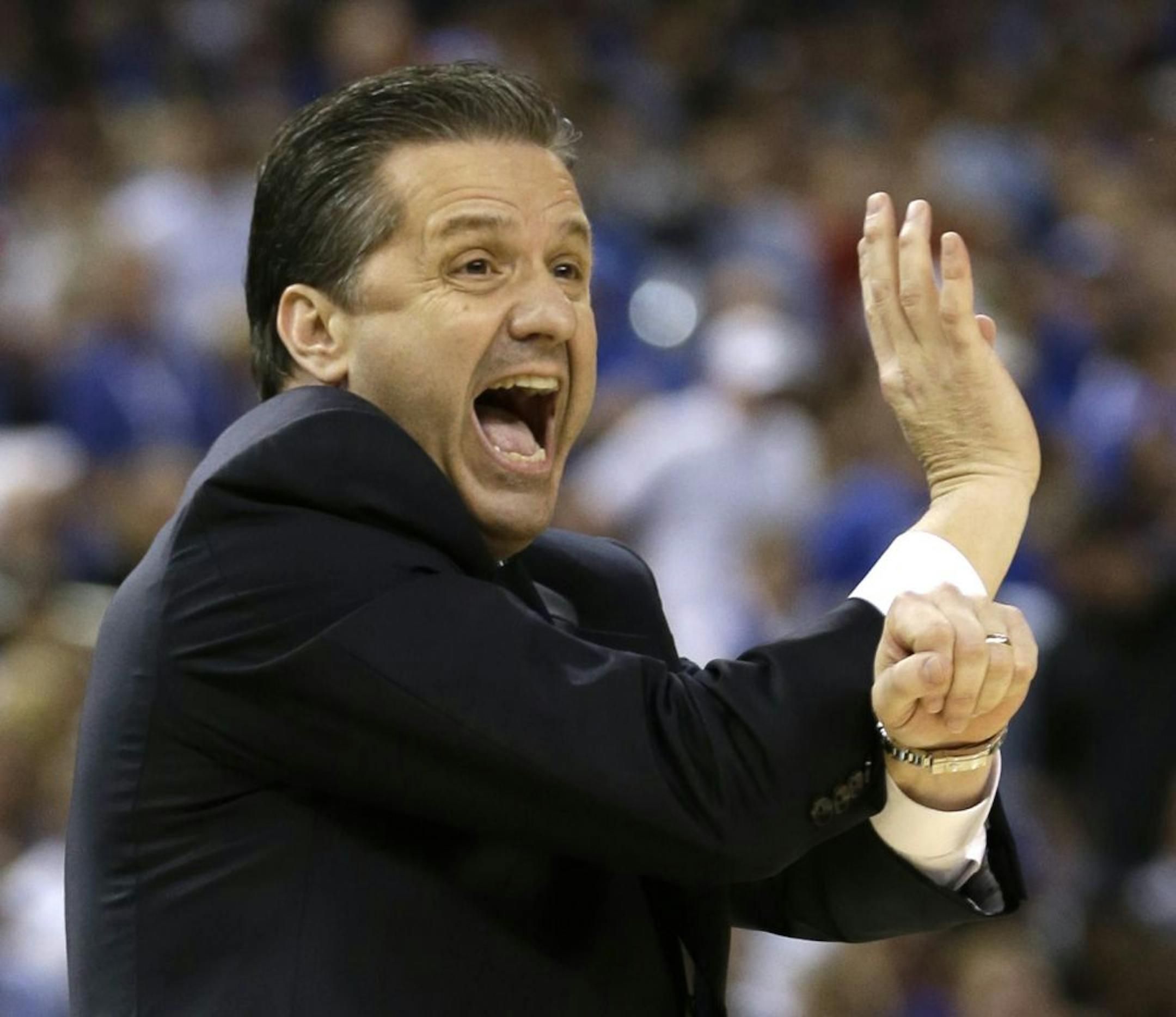 Kentucky head coach John Calipari reacts during the first half of the NCAA Final Four tournament college basketball championship game against Kansas Monday, April 2, 2012, in New Orleans.