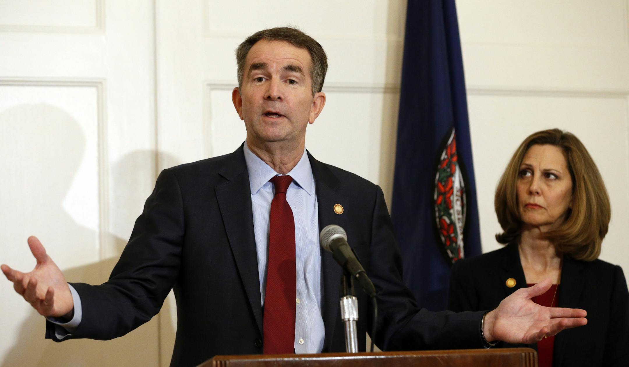 In this Feb. 2, 2019, photo, Virginia Gov. Ralph Northam, left, accompanied by his wife, Pam, speaks during a news conference in the governor's mansion in Richmond, Va. Democrats are hoping there’s a silver lining to the Northam mess - that it shows they won’t tolerate racism. Every level of the party has condemned the Democratic Virginia governor and demanded he step down. That follows disclosure that his medical school yearbook page features photos of a man in blackface standing