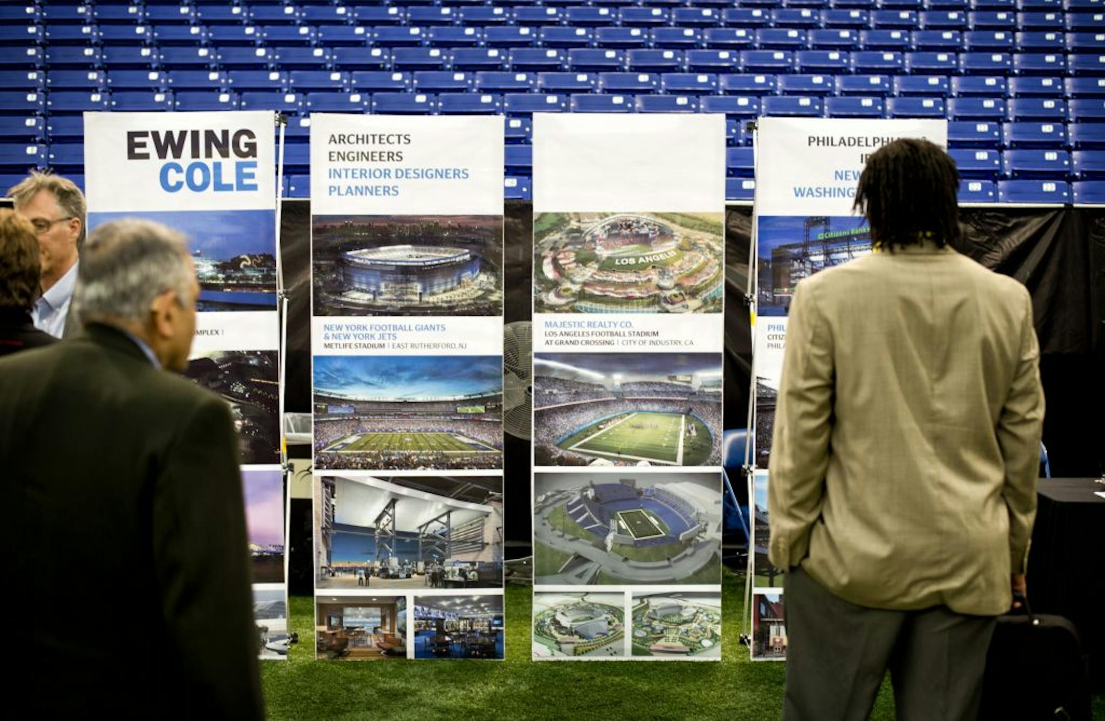The five architectural firms bidding to win the design job for the new Vikings stadium showed some of their past projects in the Metrodome on Thursday.