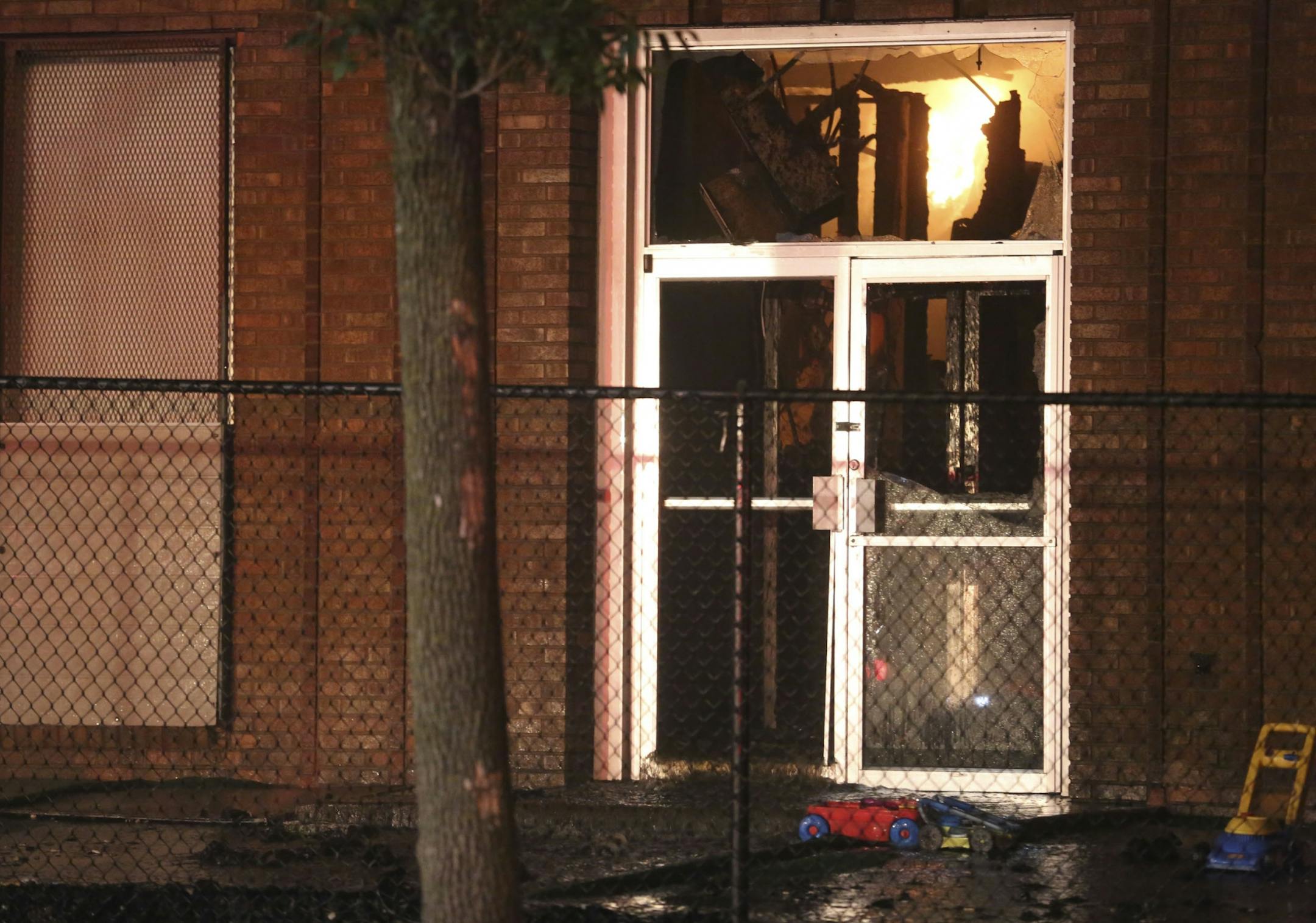 toys from a day care laid in front of the burning building firefighters worked on controlling at the 2800 block of University Ave. in Minneapolis, Min., Thursday, August 1, 2013.