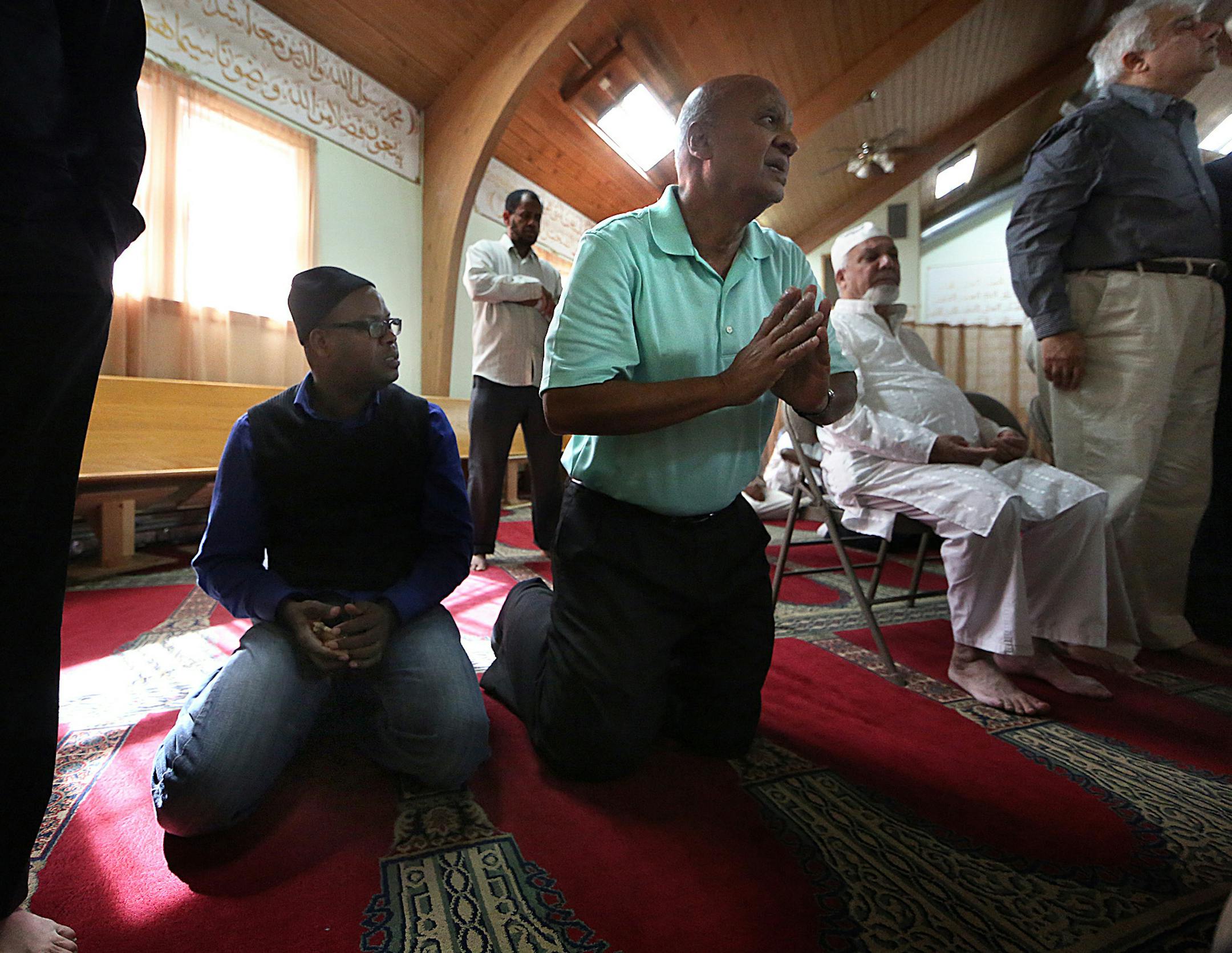 Men attended a mid-afternoon prayer and meeting at the Islamic Center of Minnesota in Columbia Heights. ] JIM GEHRZ ï james.gehrz@startribune.com / Columbia Heights, MN / October 2, 2015 / 12:00 PM ñ BACKGROUND INFORMATION: The Muslim families rallying in support of the new Quran school seemed to swallow up the opposition. Families with children, parents and grandparents filled nearly every chair, lined the walls and overflowed the Blaine City Council Chambers. The atmosphere was almos