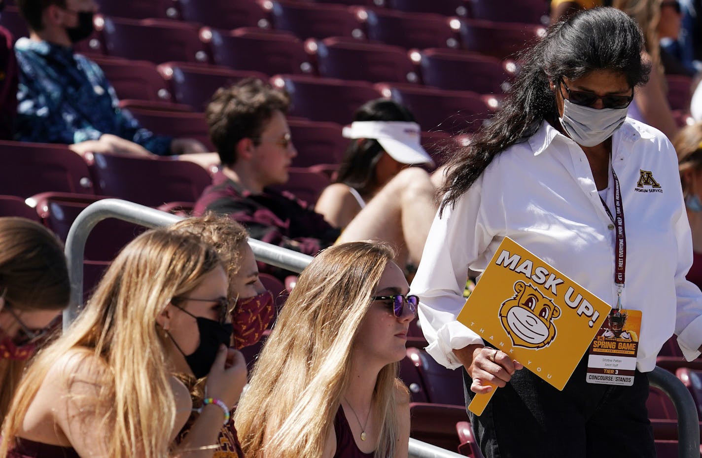 A stadium attendant reminded fans to wear their face masks per COVID-19 protocol in the second quarter Saturday. ] ANTHONY SOUFFLE • anthony.souffle@startribune.com