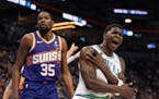 Wolves guard Anthony Edwards (5) reacts after a non-call on Suns forward Kevin Durant in the disastrous first quarter for the home team Sunday, as Pho