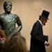 The six-foot four President Lincoln walked past an even taller Jolly Green Giant at the History Center. President Abraham Lincoln in the body of Georg