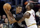 Timberwolves guard/forward Andrew Wiggins tried to make a move on the Cavaliers' Dion Waiters in a December 2014 game.