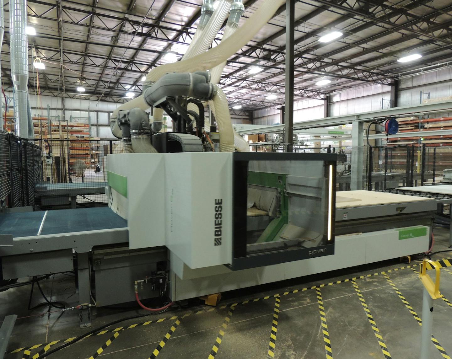 A machine imported from Italy cuts wood at the Crystal Cabinet Works.