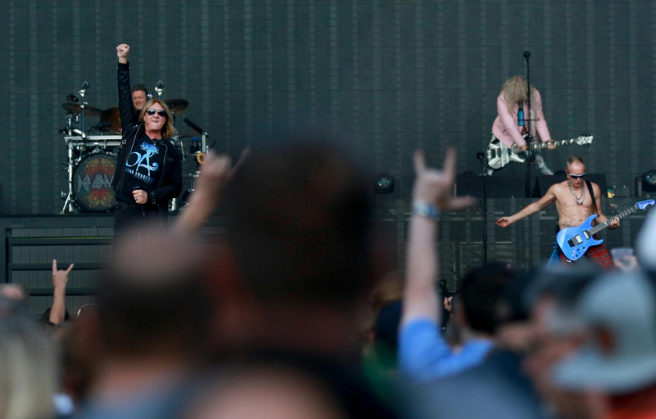 Def Leppard, including Joe Elliot, lead vocals, Rick Allen drums and Rick Savage on bass guitar, performed Friday, July 27, 2018, at Target Field in Minneapolis, MN.