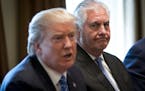 FILE-- Secretary of State Rex Tillerson listens as President Donald Trump speaks during a meeting with Malaysian Prime Minister Najib Razak in the Cab