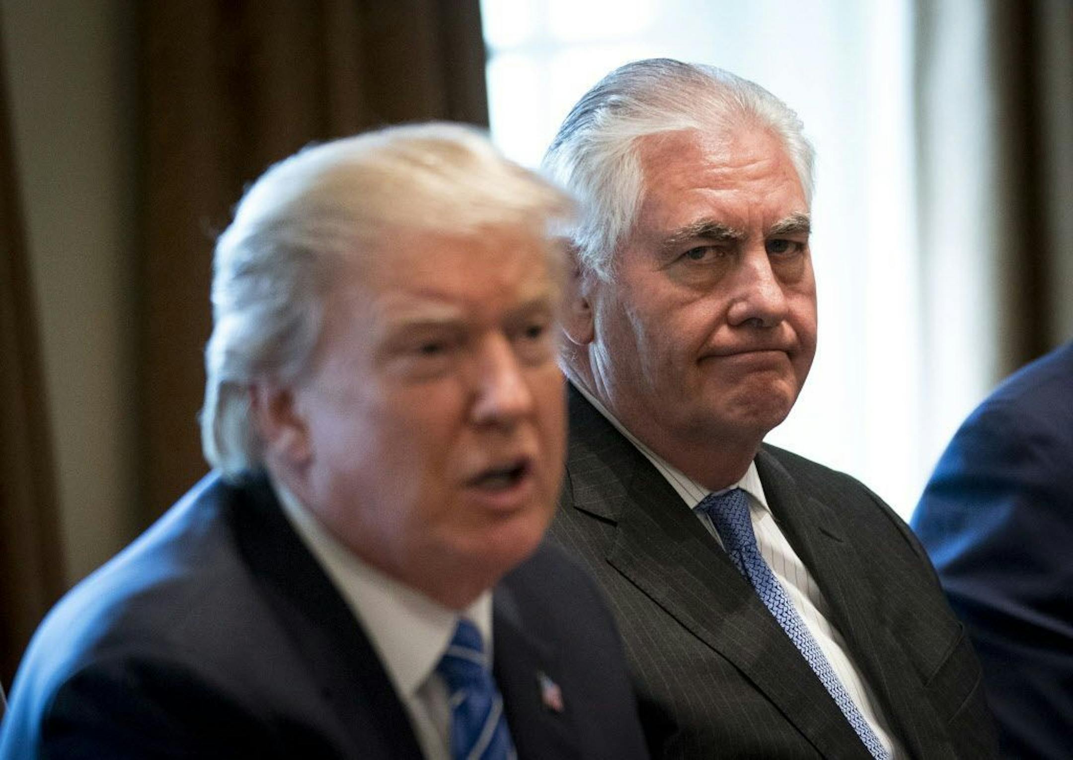 FILE-- Secretary of State Rex Tillerson listens as President Donald Trump speaks during a meeting with Malaysian Prime Minister Najib Razak in the Cabinet Room of the White House, in Washington, Sept. 12, 2017. The White House has developed a plan to force out Tillerson, whose relationship with Trump has been strained, and replace him with Mike Pompeo, the CIA director, within the next several weeks, senior administration officials said on Nov 30, 2017.