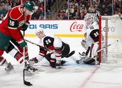 Thomas Vanek (26) was defended by Kyle Chipchura (26) and goalie Louis Domingue (35) in the first period.