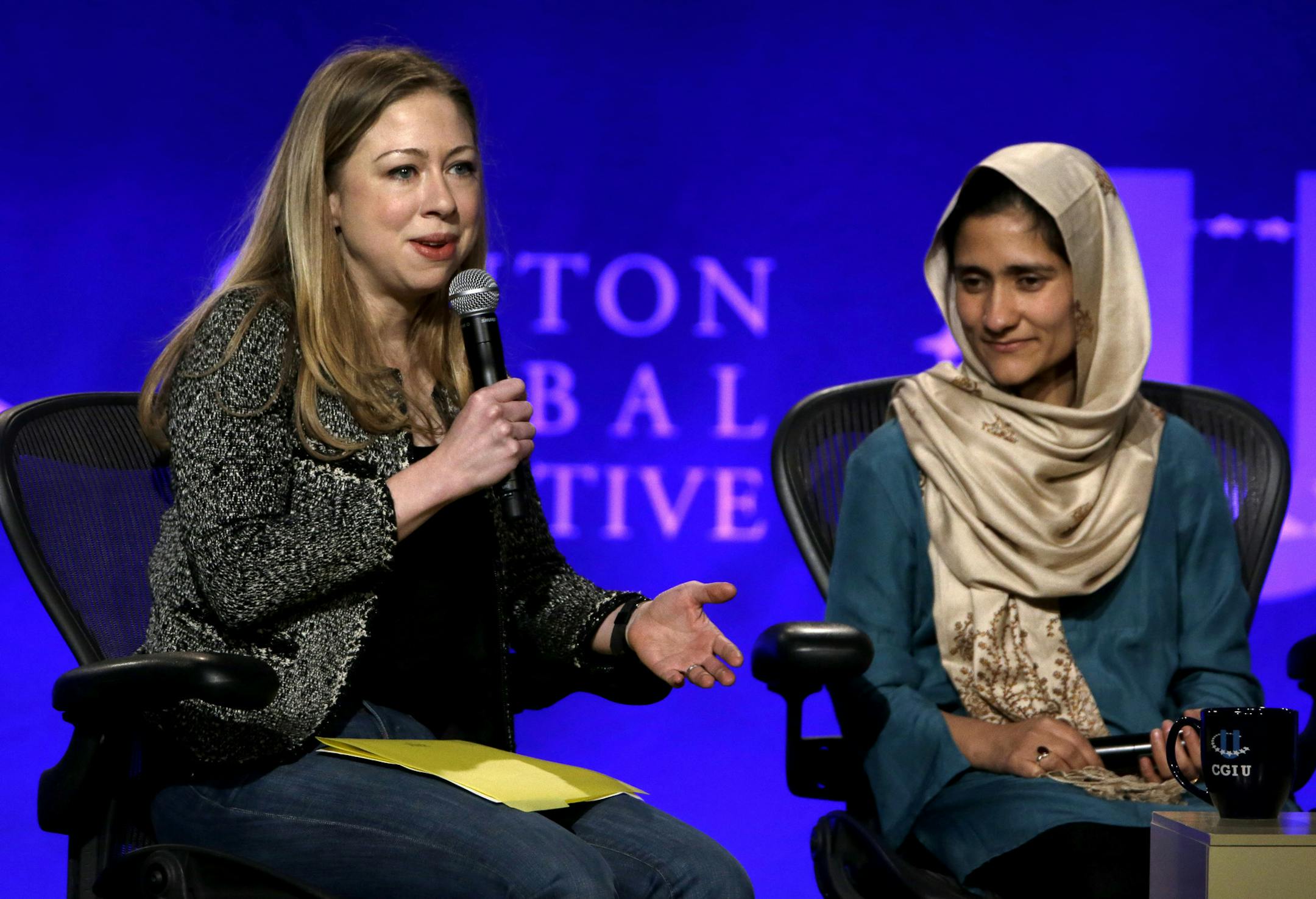 Chelsea Clinton, left, and Shabana Basij-Rasikh, managing director for the School of Leadership in Afghanistan in take part in a discussion on empowering women during the Clinton Global Initiative at Washington University Saturday, April 6, 2013, in St. Louis.