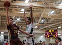 Braedy Laliberte of Maple Grove went to the basket against JJ Ware of Park Center on Friday, when Maple Grove won 67-64 and shook up the Metro Top 10.