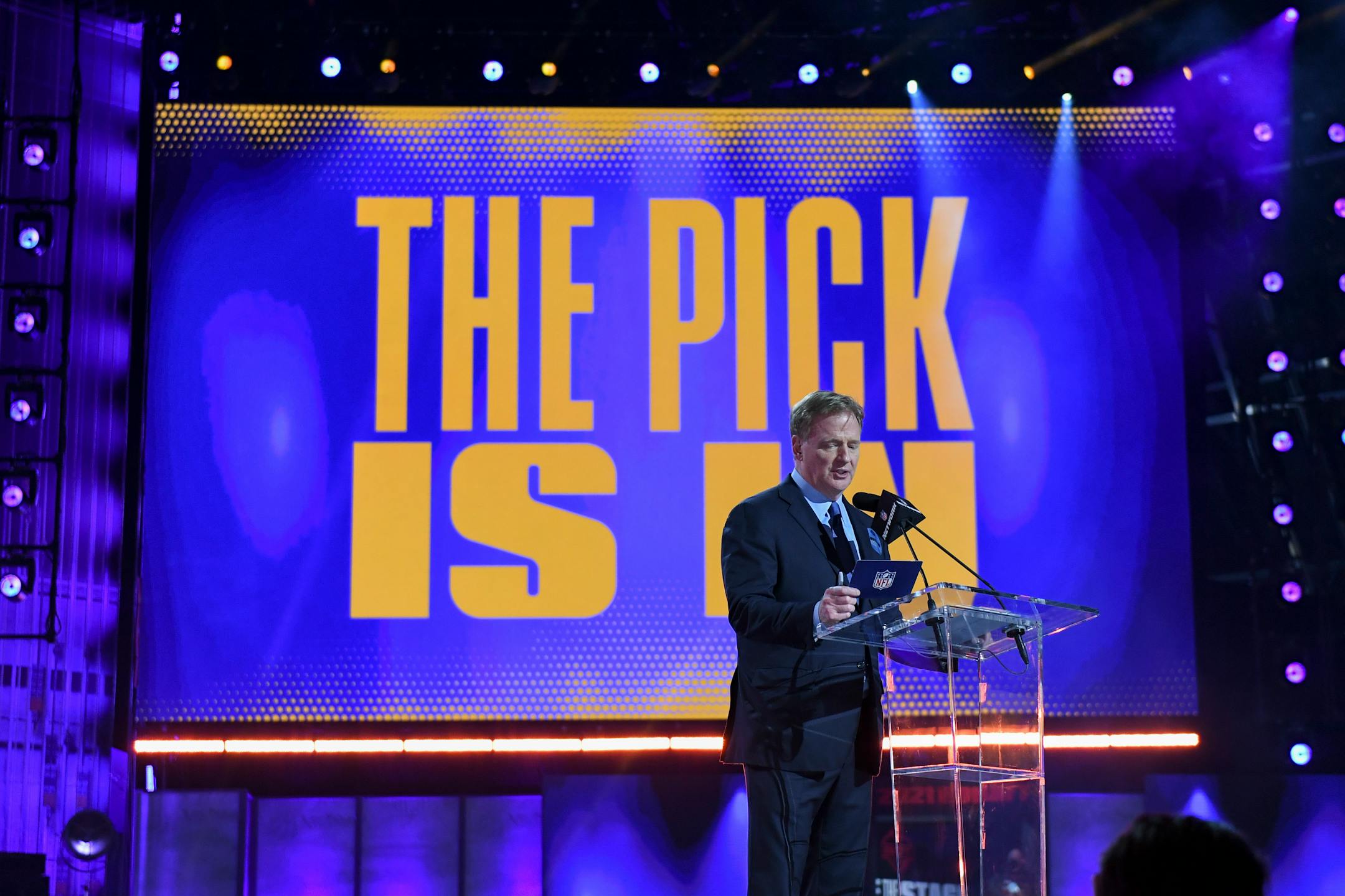 NFL Commissioner Roger Goodell addresses the crowd as the first round of the NFL football draft finishes early Friday, April 30, 2021, in Cleveland. (AP Photo/David Dermer)