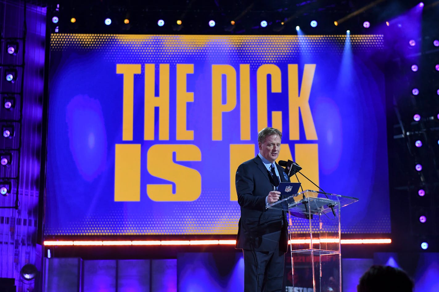 NFL Commissioner Roger Goodell addresses the crowd as the first round of the NFL football draft finishes early Friday, April 30, 2021, in Cleveland. (AP Photo/David Dermer)