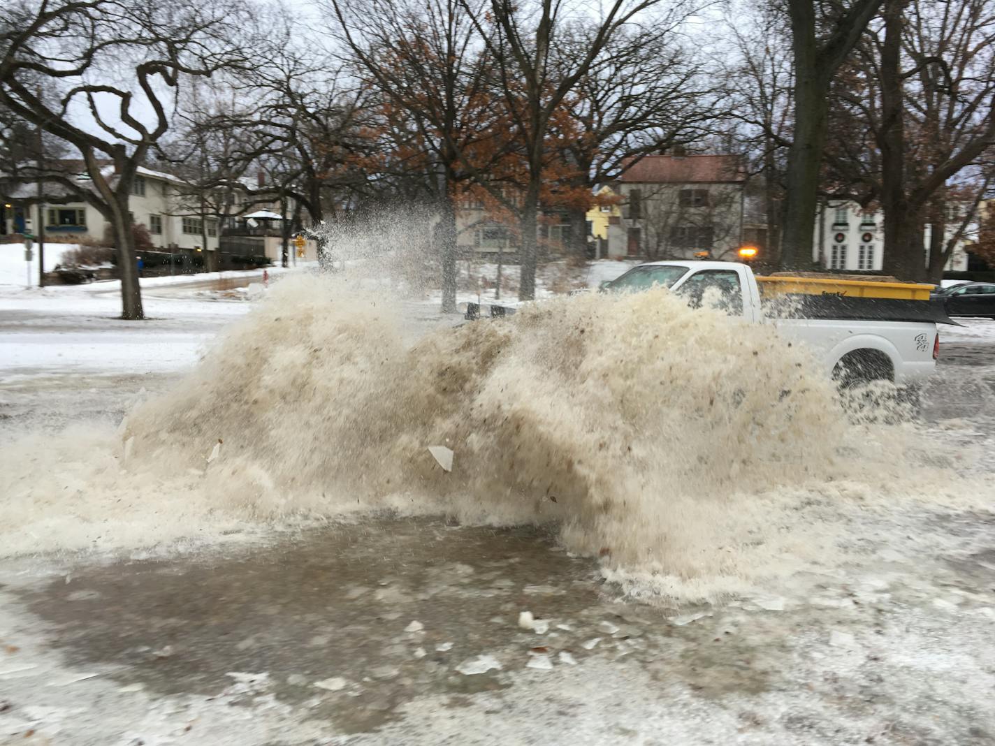 A truck tries to clear the bike path at Dean Parkway and 28th St. in south Minneapolis early Friday. Snow followed by rain on Thursday left slushy, slippery conditions around the Twin Cities on Friday.