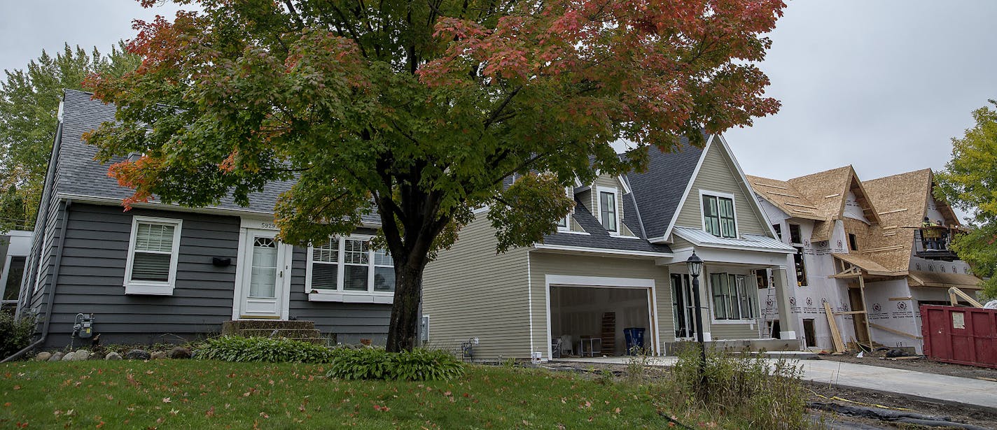 A Refined home built between an older home to the left, and a newer home being built by another company on the right, in the Pamela Park Neighborhood, Friday, October 5, 2018 in Edina, MN. ] ELIZABETH FLORES &#xef; liz.flores@startribune.com