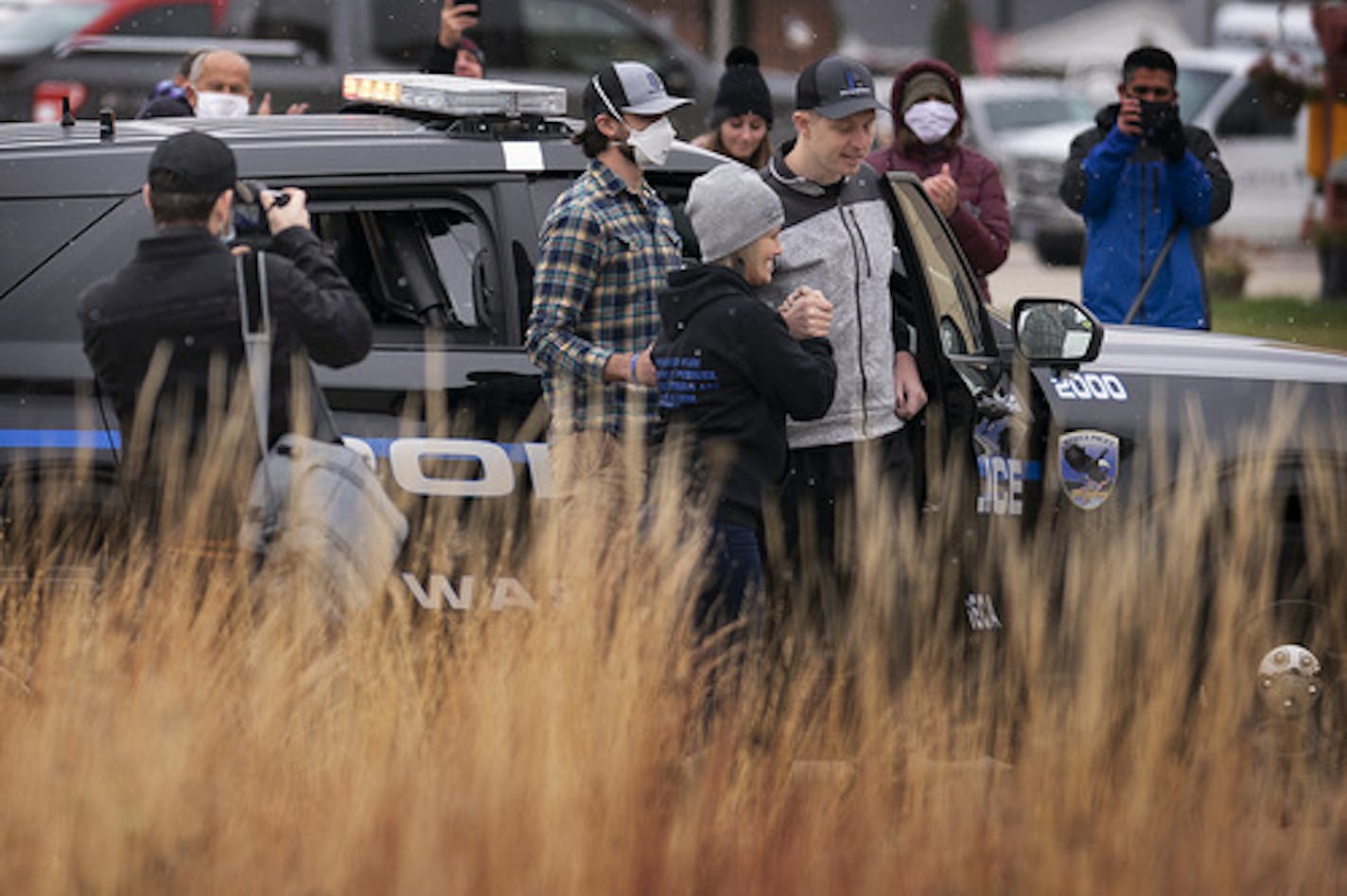 Officer Arik Matson with his wife Megan at his side arrives at the Waseca Public Safety building.] Jerry Holt •Jerry.Holt@startribune.com Officer Arik Matson, who was shot in the line of duty on January 6th, 2020 was greeted at the Waseca Public Safety building to Monday, October 19, 2020.