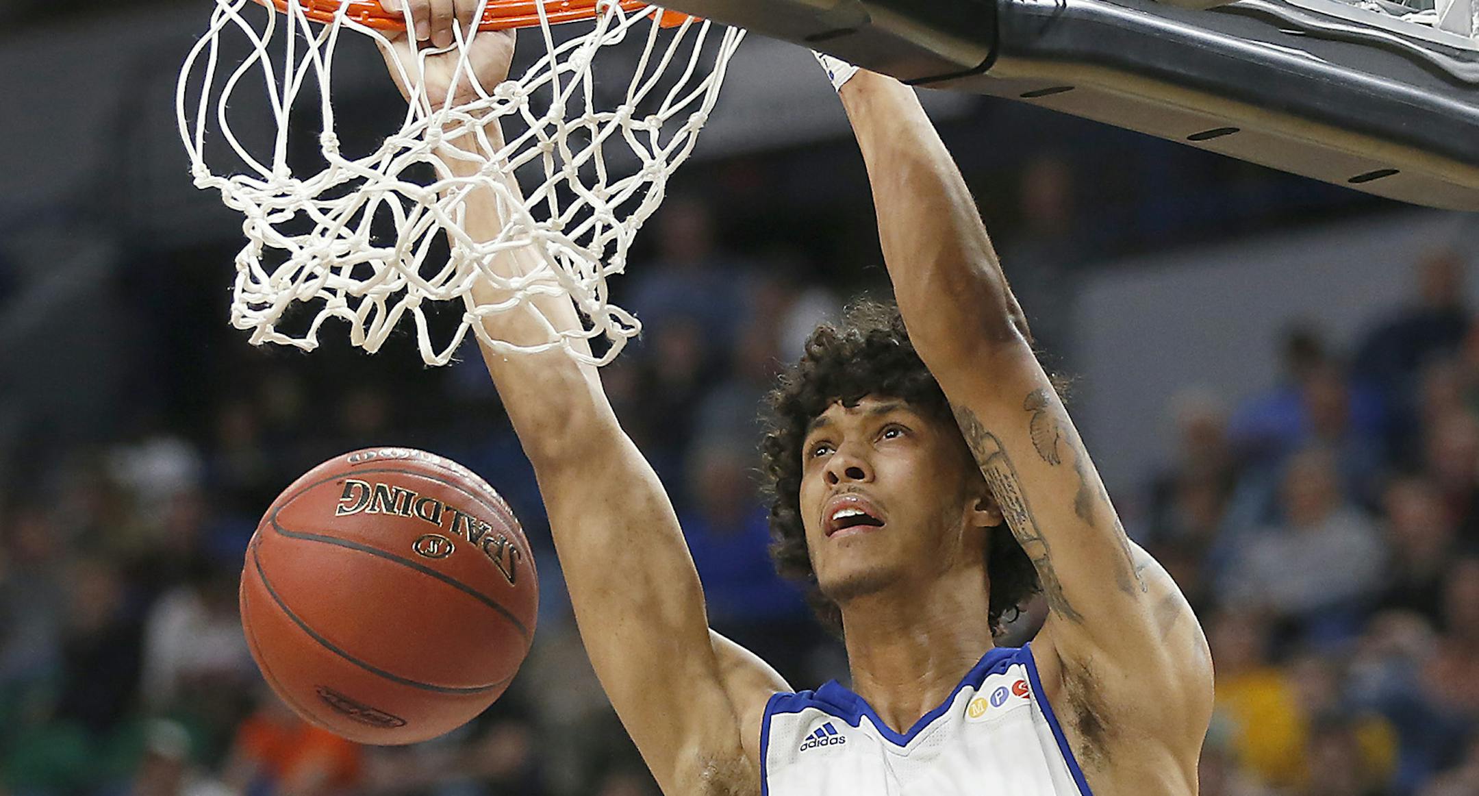 Minneapolis North's Isaac Johnson dunked the ball during the first half of the boys' basketball Class 1A semifinals at the Target Center, Friday, March 24, 2017 in Minneapolis, MN. ] ELIZABETH FLORES ï liz.flores@startribune.com