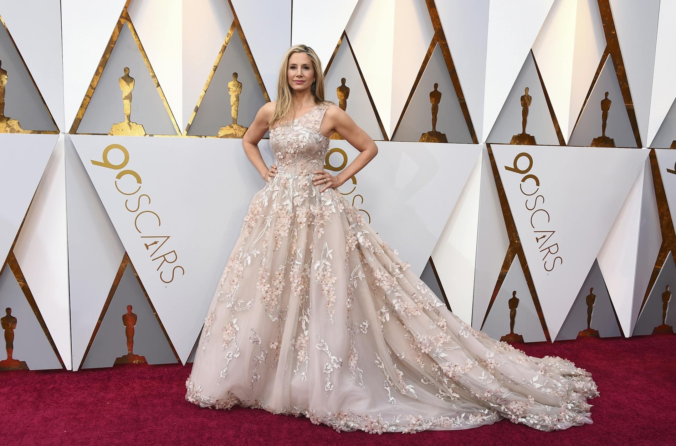 Mira Sorvino arrives at the Oscars on Sunday, March 4, 2018, at the Dolby Theatre in Los Angeles.