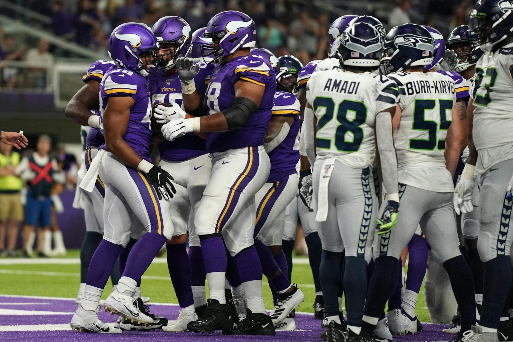 Minnesota Vikings running back Khari Blasingame (48) was congratulated by his teammates after he scored a touchdown in the second half.