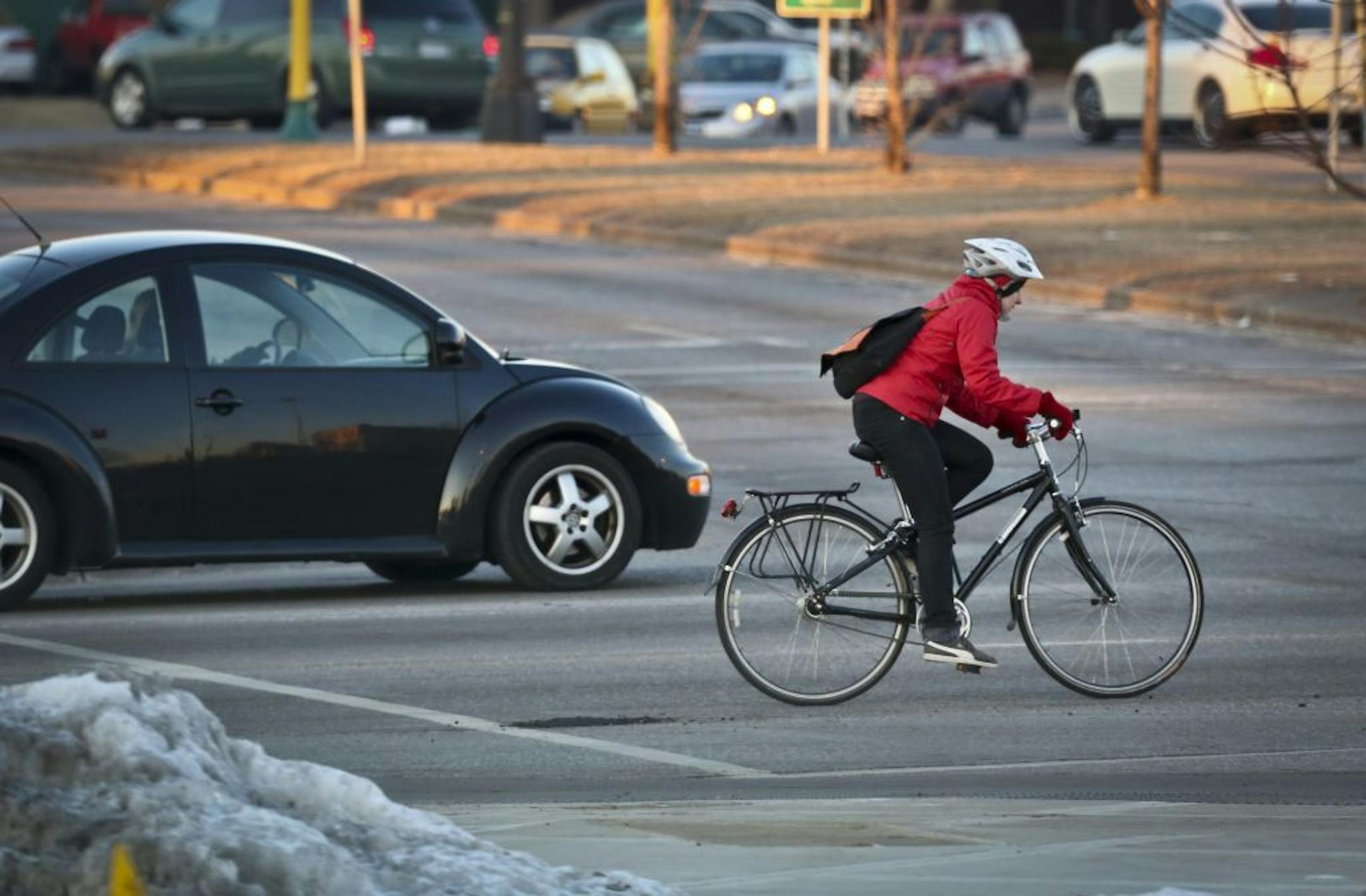 Bicyclists crossed Cedar Avenue and East Franklin Avenue in traffic on Tuesday, January 15, 2013, in Minneapolis, Minn. This intersection has had 20 bicycle/car crashes in the last ten years.