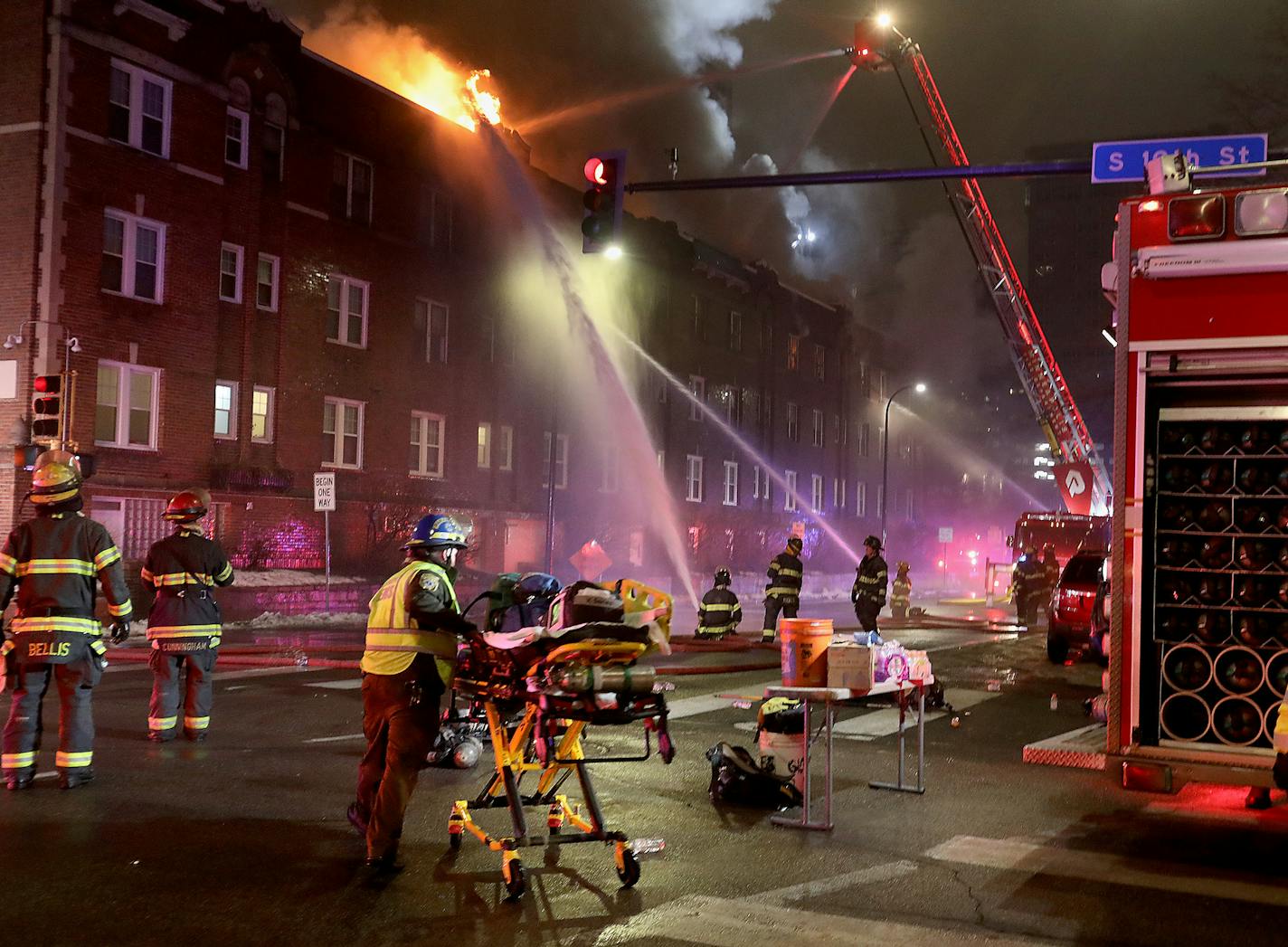 Firefighters battle a four-alarm fire at the Francis Drake Hotel apartments that broke out early Christmas Day morning Wednesday, Dec. 25, 2019, in Minneapolis.