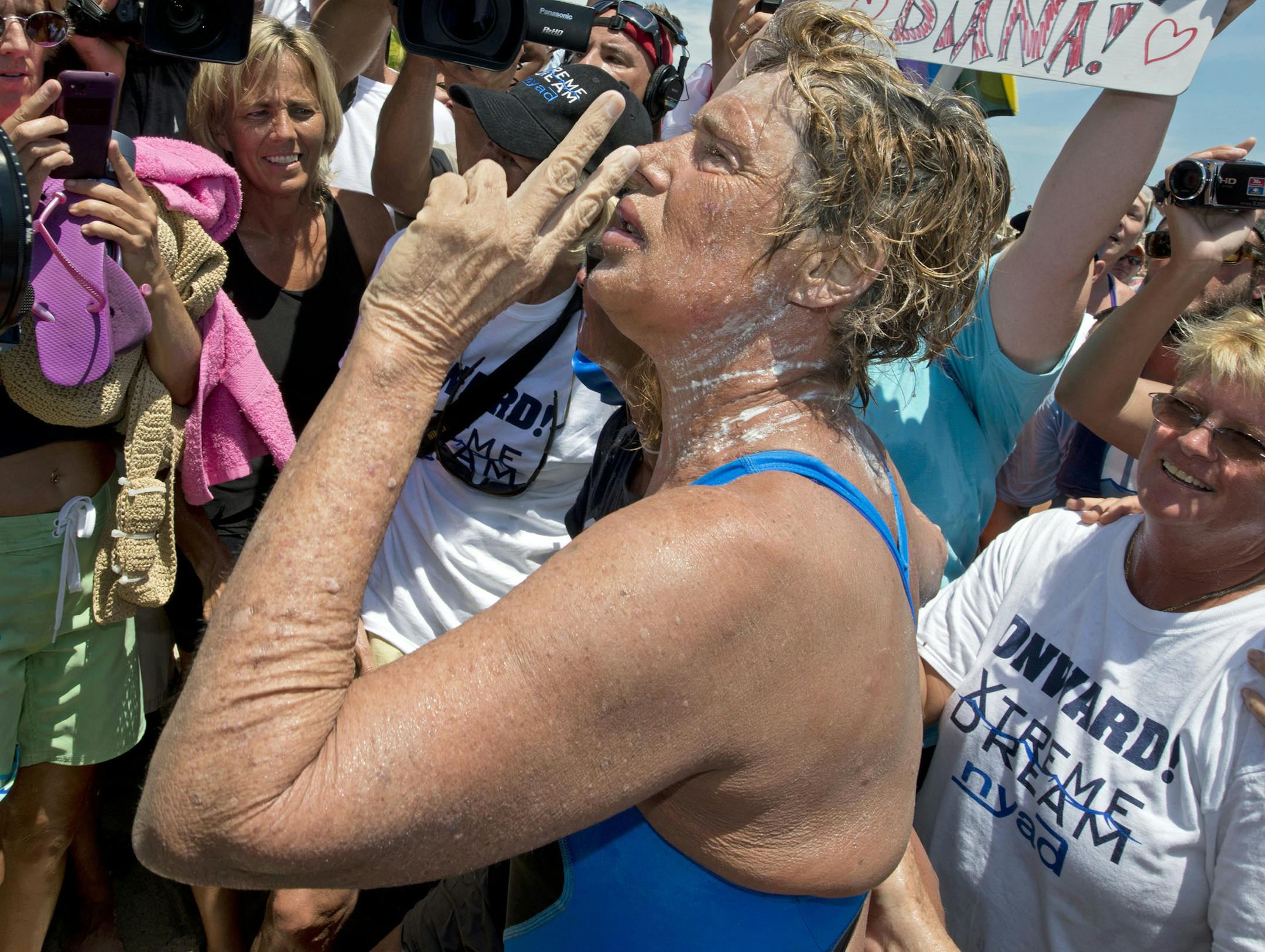 In this photo provided by the Florida Keys News Bureau, Diana Nyad tells supporters and fans that you are "never too old to chase your dreams" after completing a 111-mile swim from Cuba to Key West, Fla.