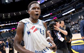 Anthony Edwards of the Wolves soaked in Sunday's Game 7 victory in Denver.