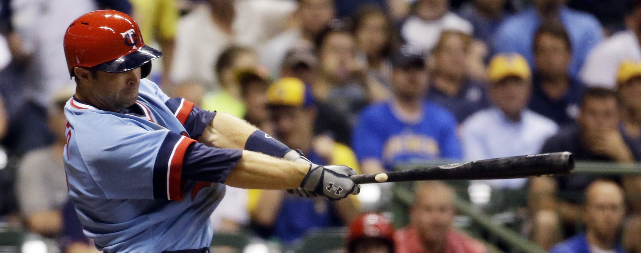 Minnesota Twins' Brian Dozier hits a two-run home run during the fifth inning of a baseball game against the Milwaukee Brewers on Tuesday, June 3, 2014, in Milwaukee. (AP Photo/Morry Gash) ORG XMIT: MIN2014062019063792