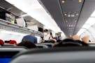 FILE — Travelers board a Jet Blue flight from Orlando International Airport in Orlando, Fla., to Washington Reagan Airport, on March 1, 2021. The Fe