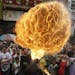 A fire-eater performs at Manila's Chinatown district of Binondo to celebrate the Chinese New Year Thursday, Feb. 19, 2015 in Manila, Philippines. This