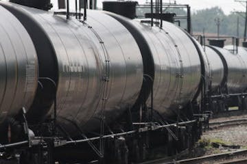 Empty railroad tank cars snake their way into a storage yard in Newark, Delaware, July 28, 2013 The cars will return to North Dakota's Bakken region t