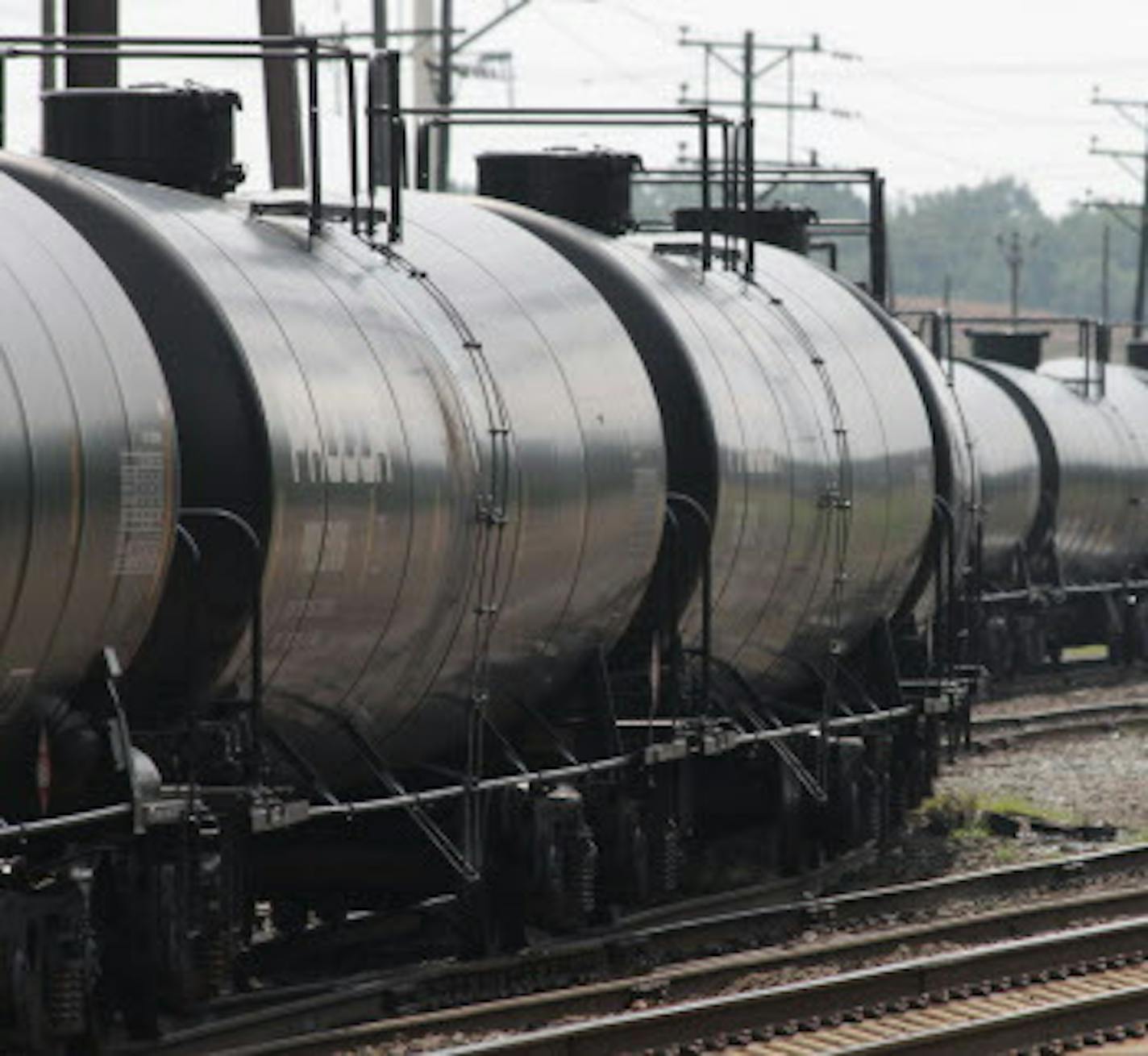 Empty railroad tank cars snake their way into a storage yard in Newark, Delaware, July 28, 2013 The cars will return to North Dakota's Bakken region to be loaded with crude oil for another trip to the refinery at Delaware City, Delaware. With a shortage of new pipeline capacity, oil producers have been using rail as an alternative, and in some cases it's the preferred mode. (Curtis Tate/MCT) ORG XMIT: 1141528 ORG XMIT: MIN1307311129274647