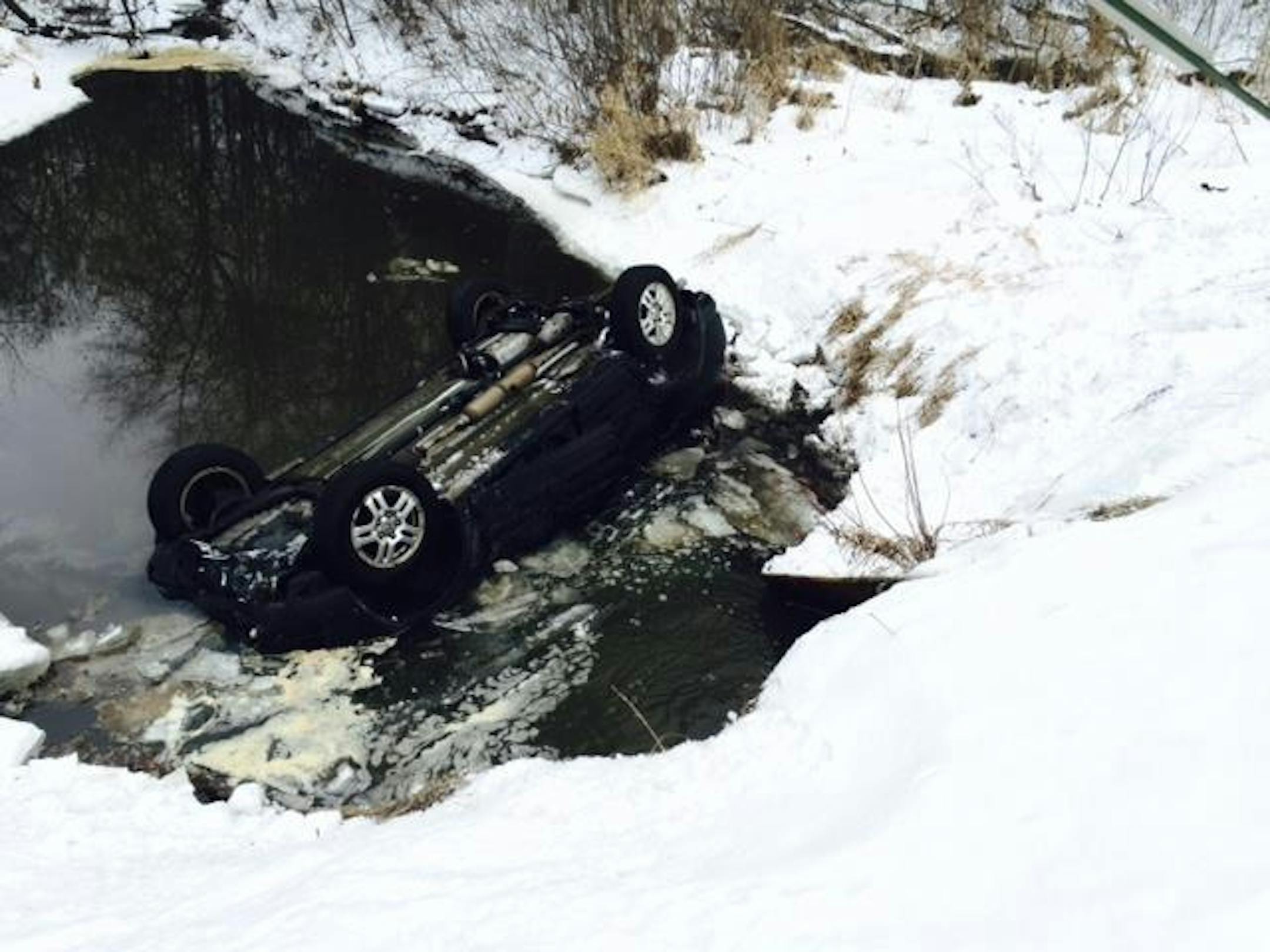 A driver was rescued from this SUV in an Isanti County creek.