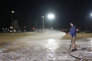 Minneapolis parks employee Sean Linden worked to build ice at McRae Park in Minneapolis in late December. High temperatures kept Minneapolis' ice rink