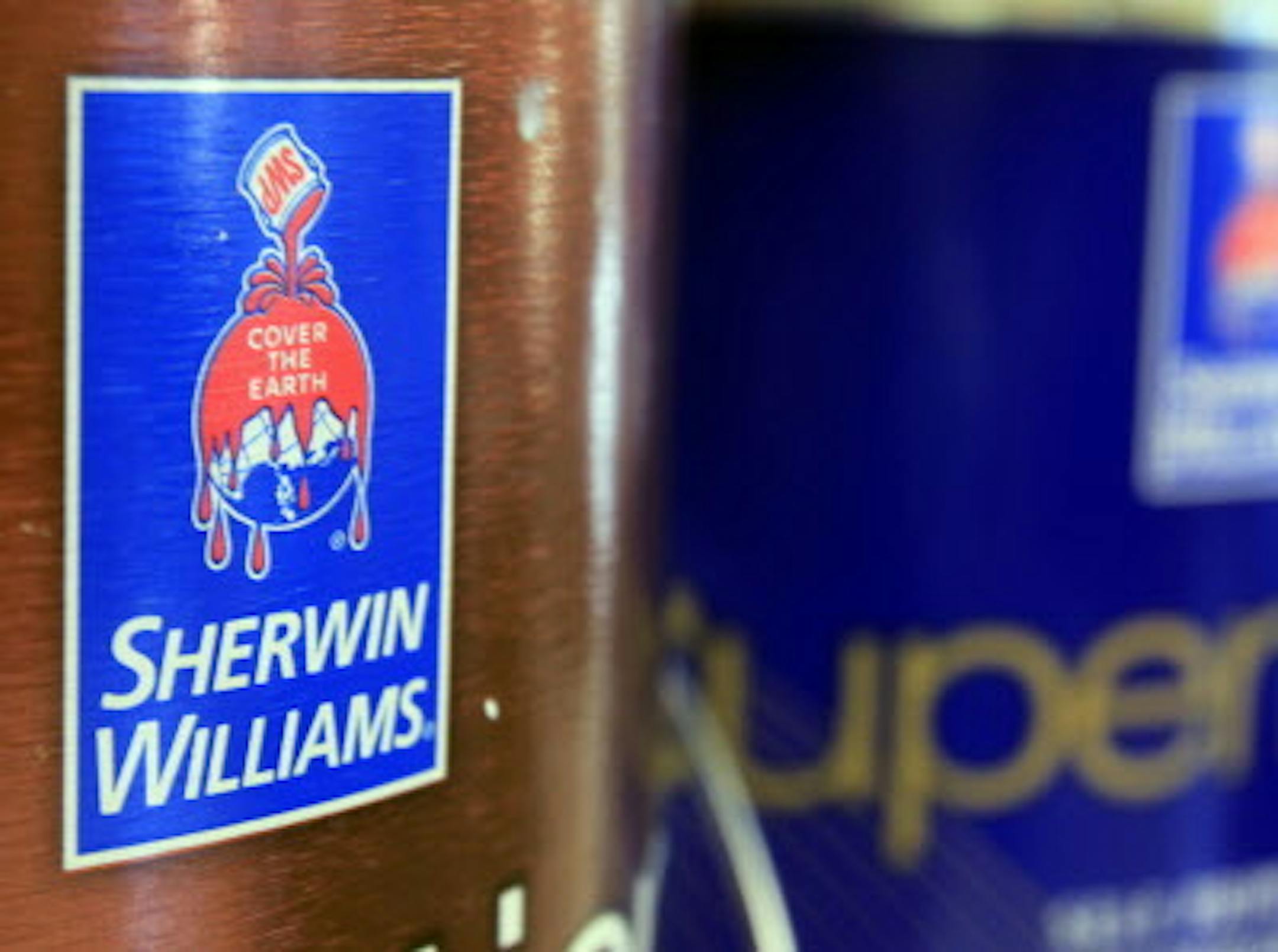 FILE - In this Oct. 20, 2010, file photo, cans of paint are seen at a Sherwin Williams store in Brunswick, Maine. Paint company Sherwin-Williams is buying rival Valspar for $11.3 billion in a move that it says will expand its reach in Asia and Europe. (AP Photo/Pat Wellenbach, File)