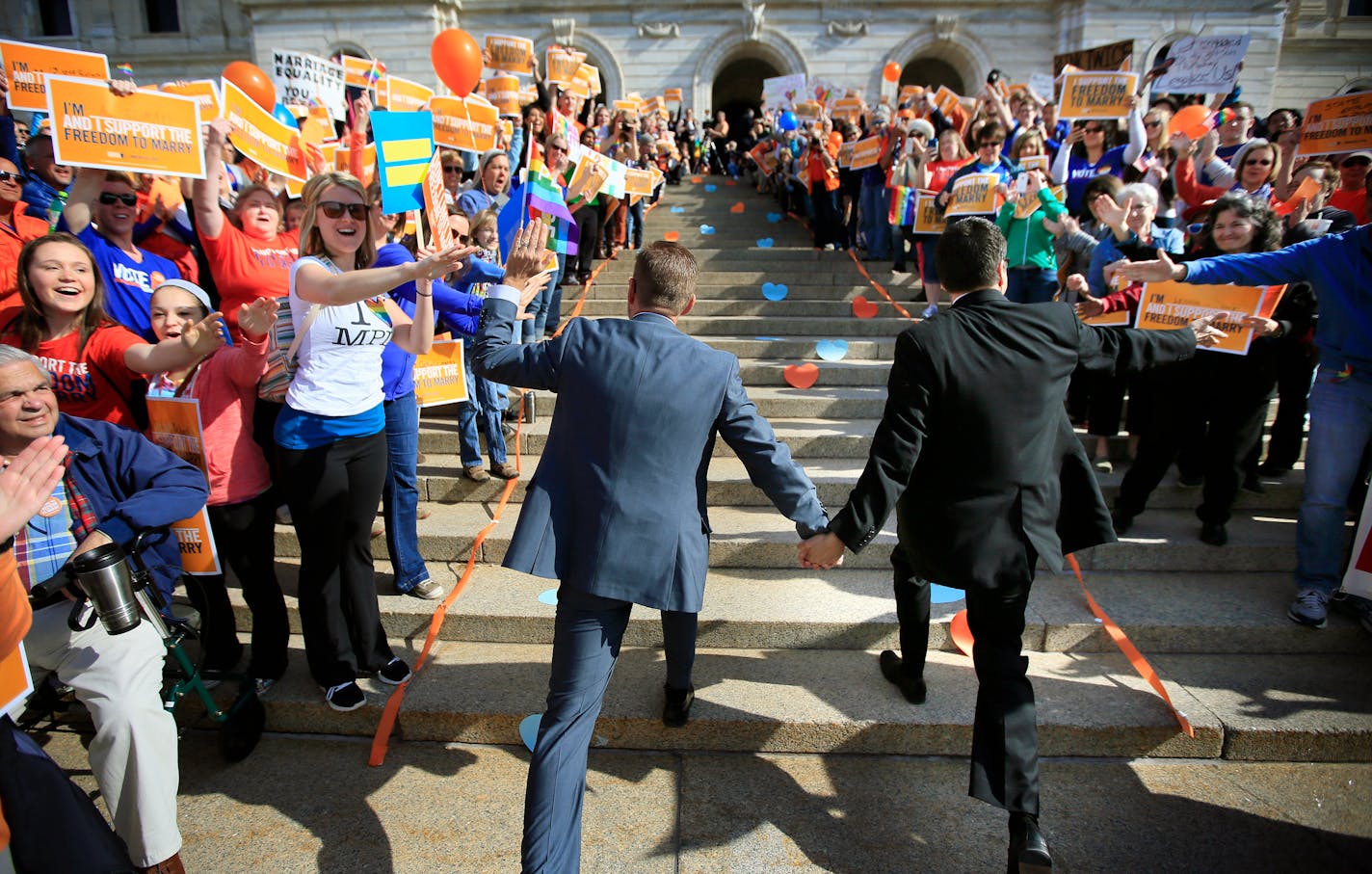 The Minnesota Senate will bring to a close the state's long and wrenching conversation about same-sex marriage as it takes votes to legalize gay couples' unions. Early monday morning, senators were greeted by a large cheering crowd of Same Sex Marriage supporters on the Capitol steps. Here, Senator Scott Dibble and his husband Richard Leyva run up the capitol steps, hand-in-hand, greeted by a cheering crowd of supporters.] BRIAN PETERSON â€¢ brianp@startribune.com St. Paul, MN - 05/13/2013