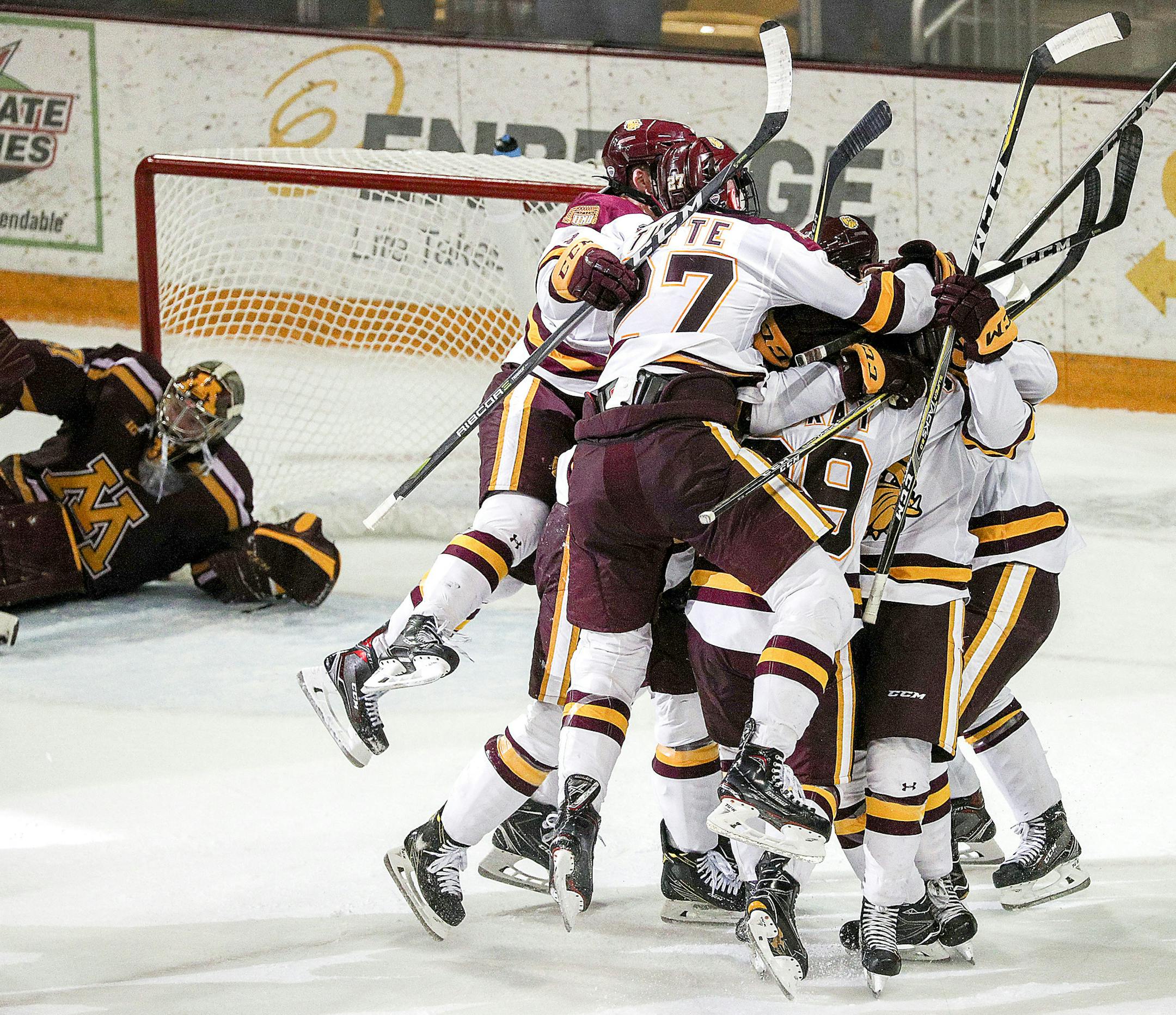 t092717 --- Clint Austin --- 100717.S.DNT.UMDPUX.C13 --- Minnesota Duluth players react after Parker Mackay scored the game winning goal in overtime against Minnesota during the Ice Breaker Tournament at Amsoil Arena in Duluth, Minn. Friday Oct. 6, 2017. Minnesota Duluth increases it's win streak over Minnesota to eight with the 4-3 overtime victory. (Clint Austin / caustin@duluthnews.com)