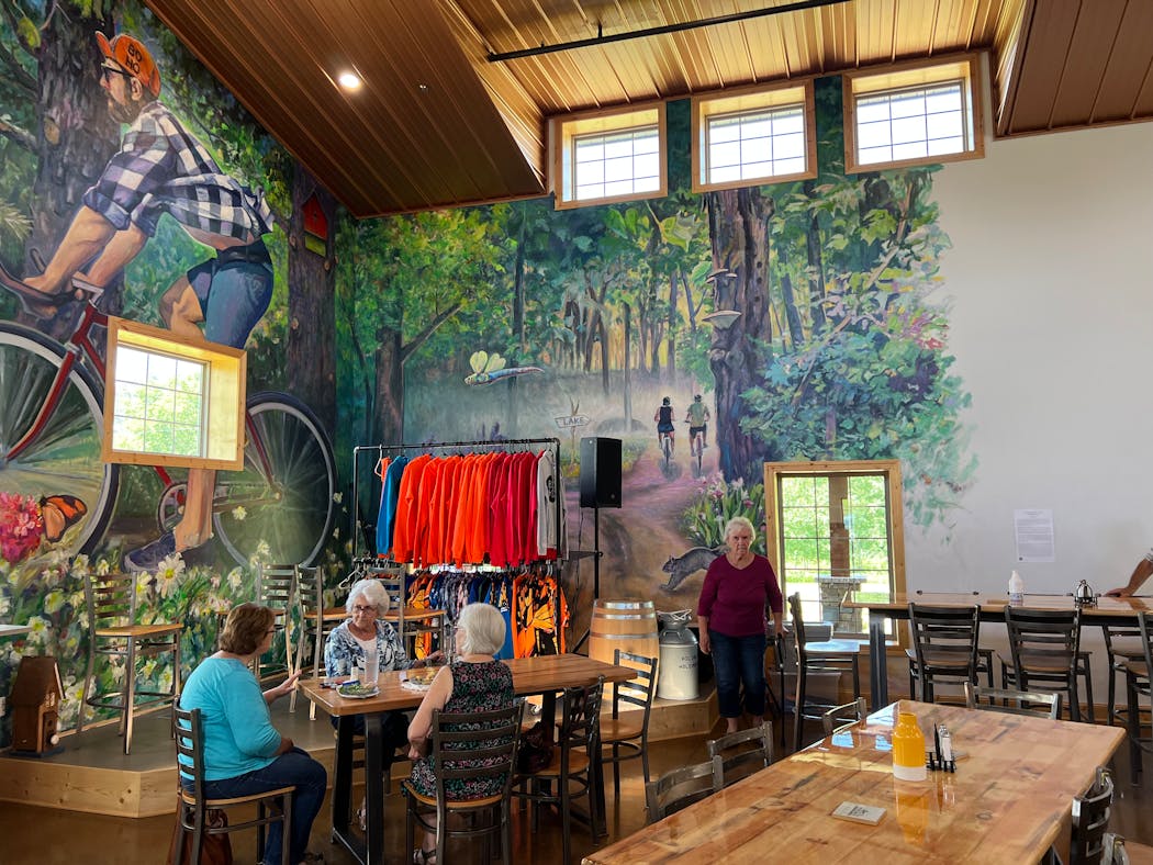 The cafe at Art in Motion features a bike-themed mural by Iowa artist Zack Jones.