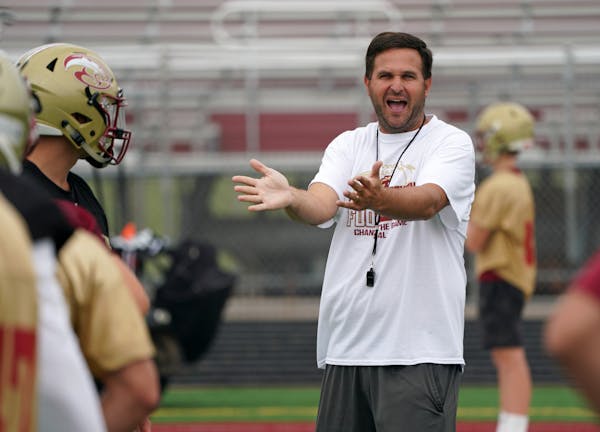 Tyler Krebs worked with the Lakeville South football team on Aug. 12, the first day of practice this year.