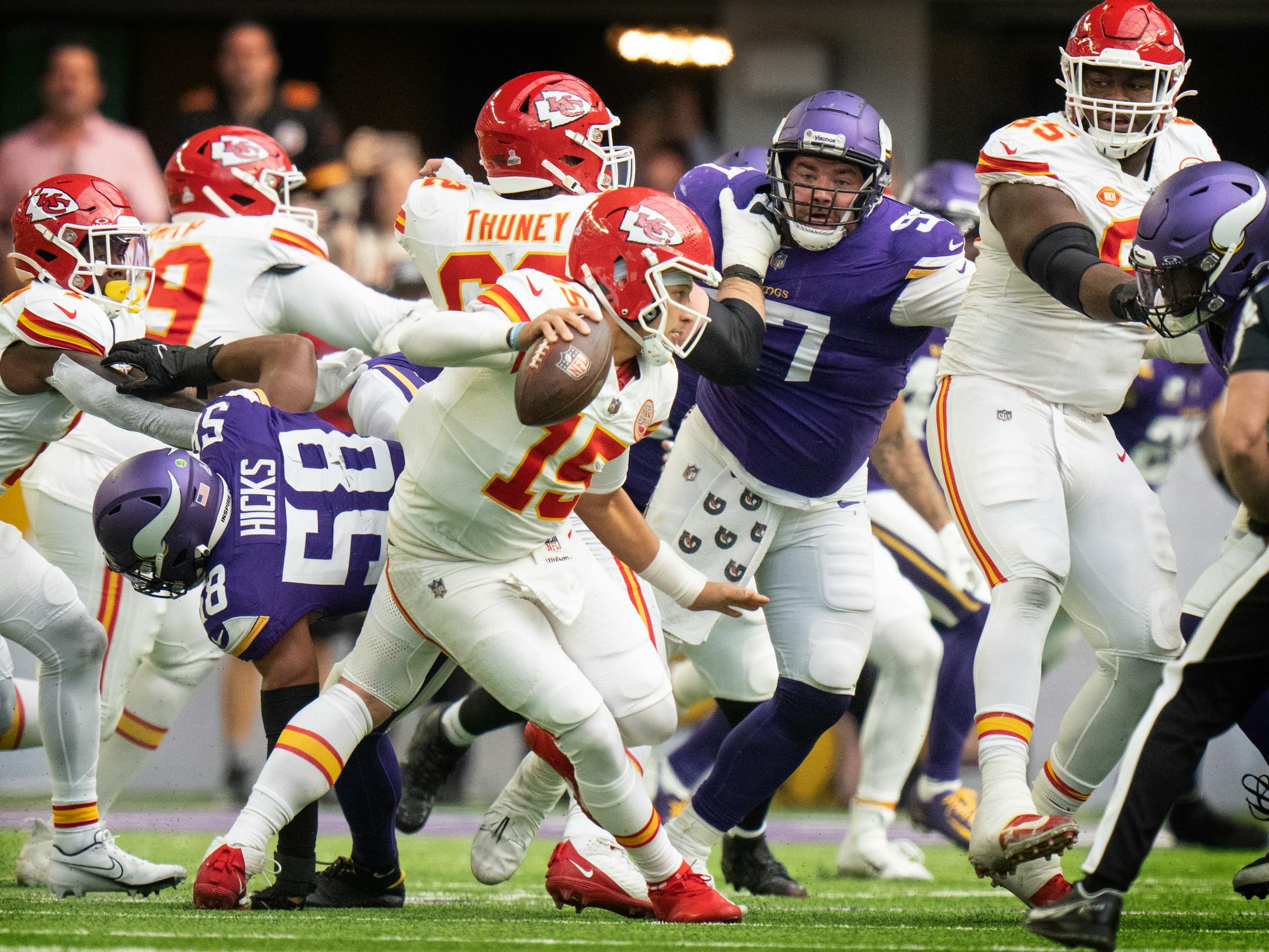 Kansas City Chiefs quarterback Patrick Mahomes (15) avoids the sack of Minnesota Vikings linebacker Danielle Hunter (99) in the second quarter.