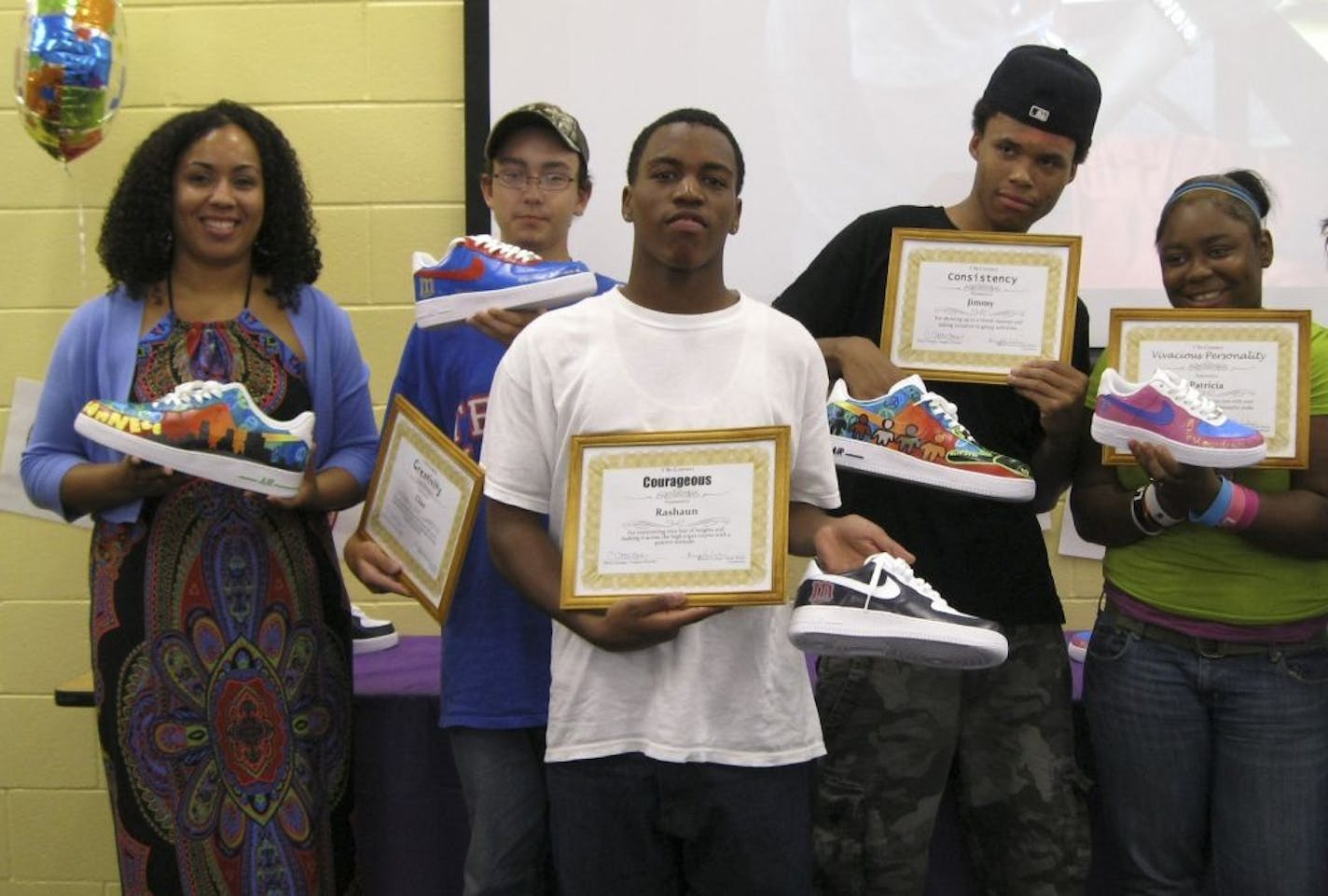 Among the creative results of the Summer 612 project: tennis shoes painted with messages of peace and hope for Minneapolis.