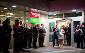Law enforcement from various local agencies saluted officer Jacob Spies upon discharge in August from North Memorial Health Hospital in Robbinsdale af