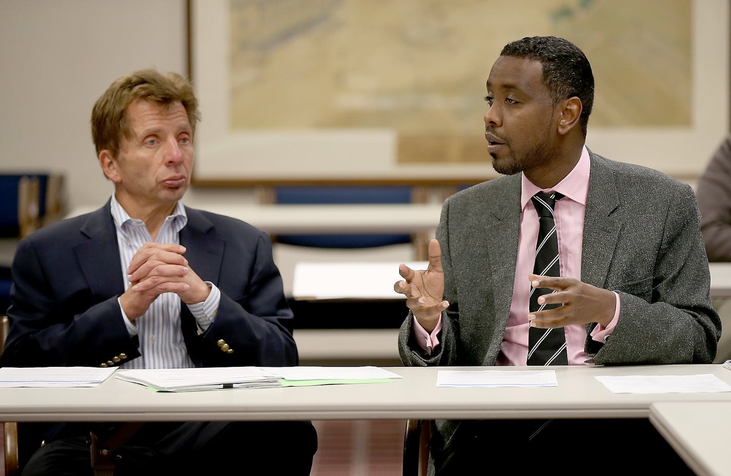 Riverside Plaza Tower owner George Sherman, left, and Council Member Abdi Warsame talked to residents regarding several issues causing turmoil, Monday, May 11, 2015 at City Hall in Minneapolis, MN. ] (ELIZABETH FLORES/STAR TRIBUNE) ELIZABETH FLORES &#x2022; eflores@startribune.com