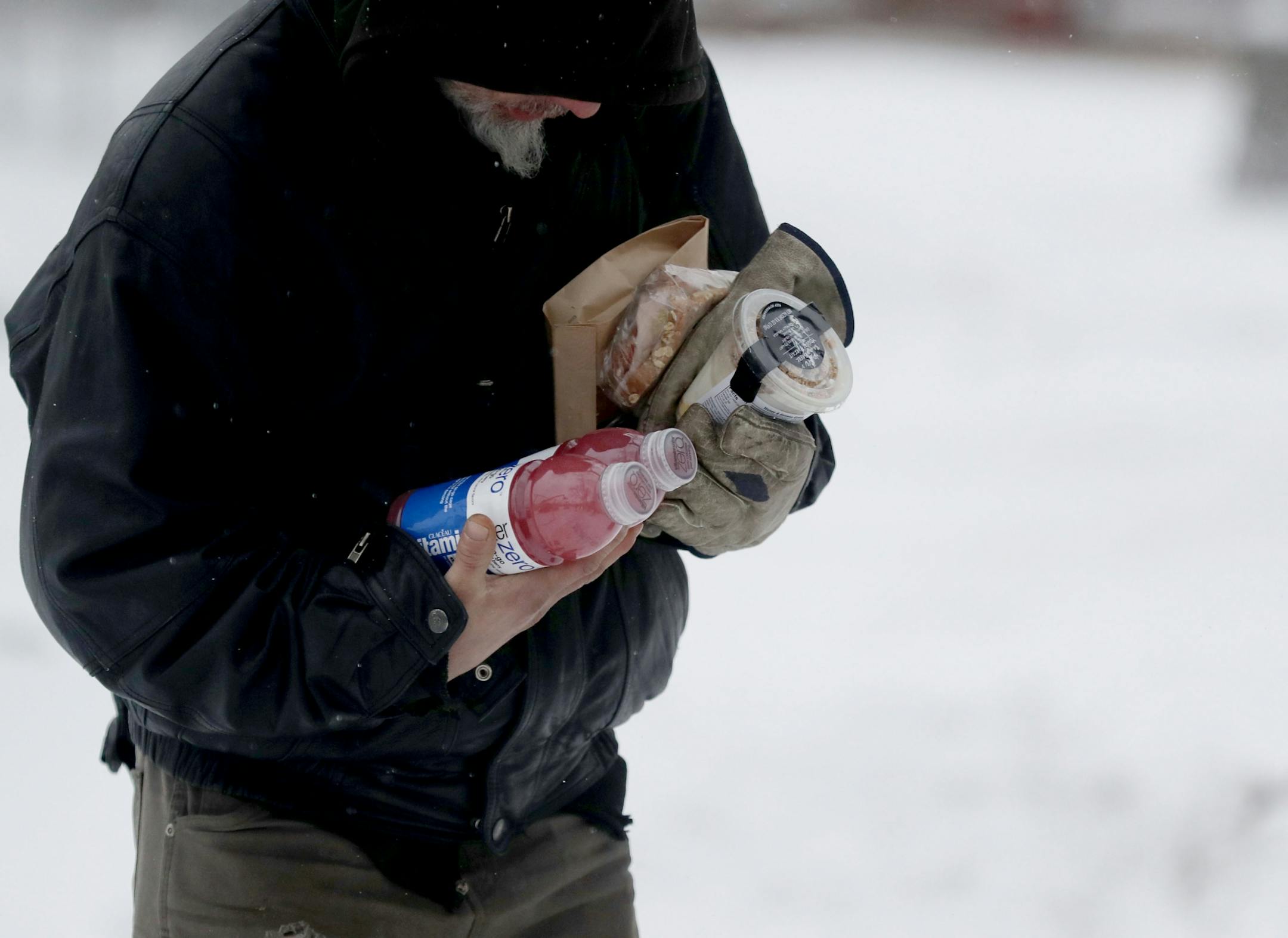 The local non-profit, Loaves and Fishes has partnered with the MSP Airport and concessionaire HMS Host to donate ready-to-eat meals not purchased at the airport, that would otherwise be thrown away, to the homeless near the Dorothy Day Center Thursday, Dec. 28, in St. Paul, MN.
