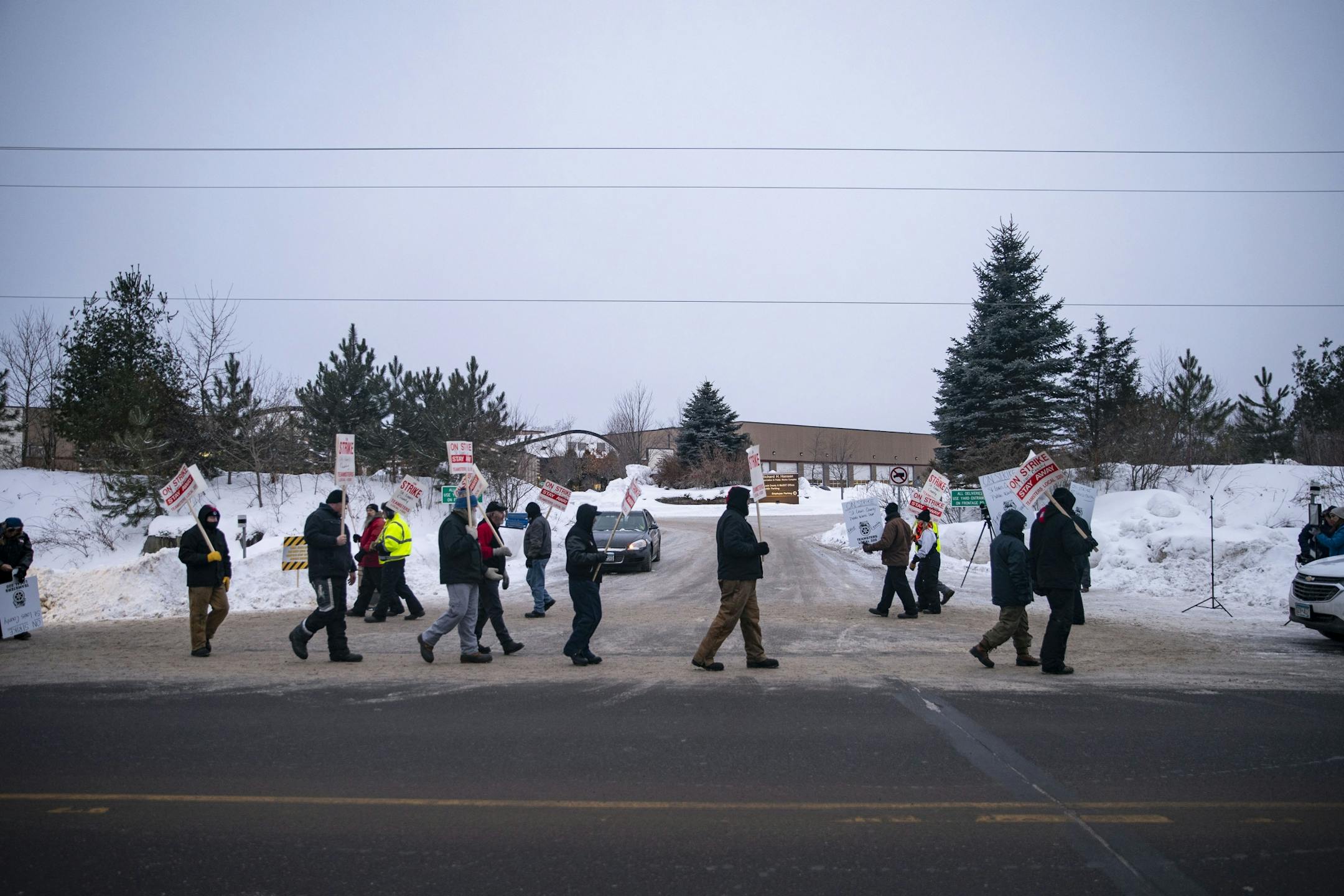 Snow plow driver picketers on strike marched in front of the St. Louis County Public Works Department building in Pike Lake, MN on January 15, 2020.