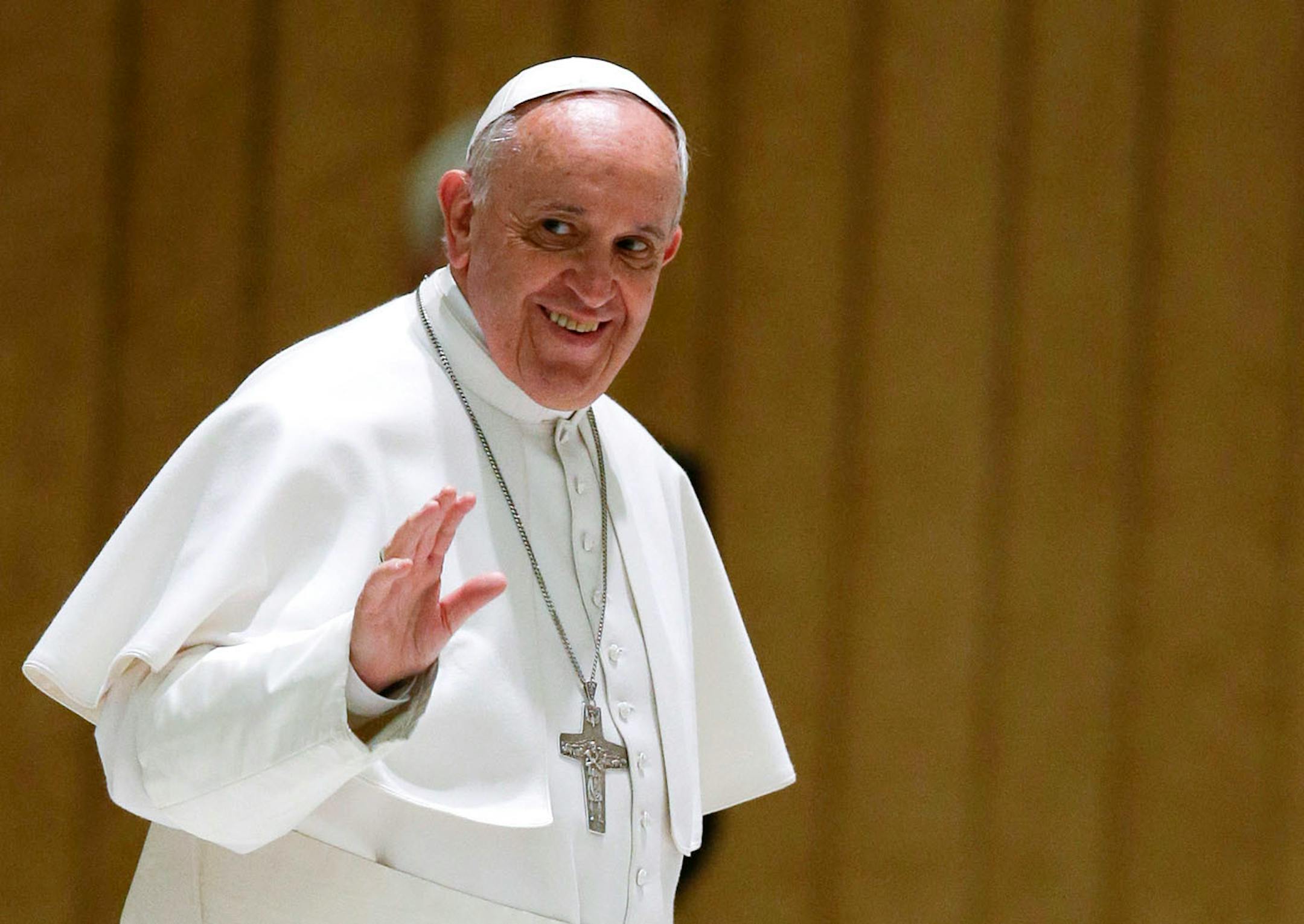 Pope Francis waves to faithful as he arrives on the occasion of an audience with participants to the course promoted by the Penitentiary Apostolic Tribunal, in the Paul VI hall at the Vatican.