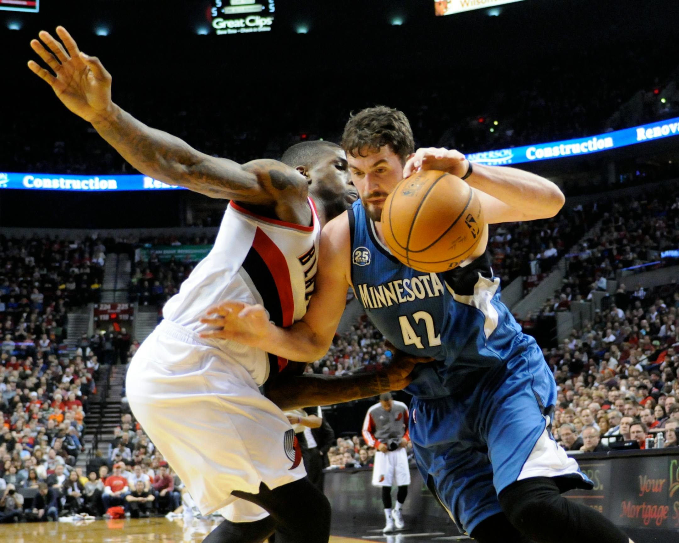 Wolves forward Kevin Love drove against Portland's Thomas Robinson.