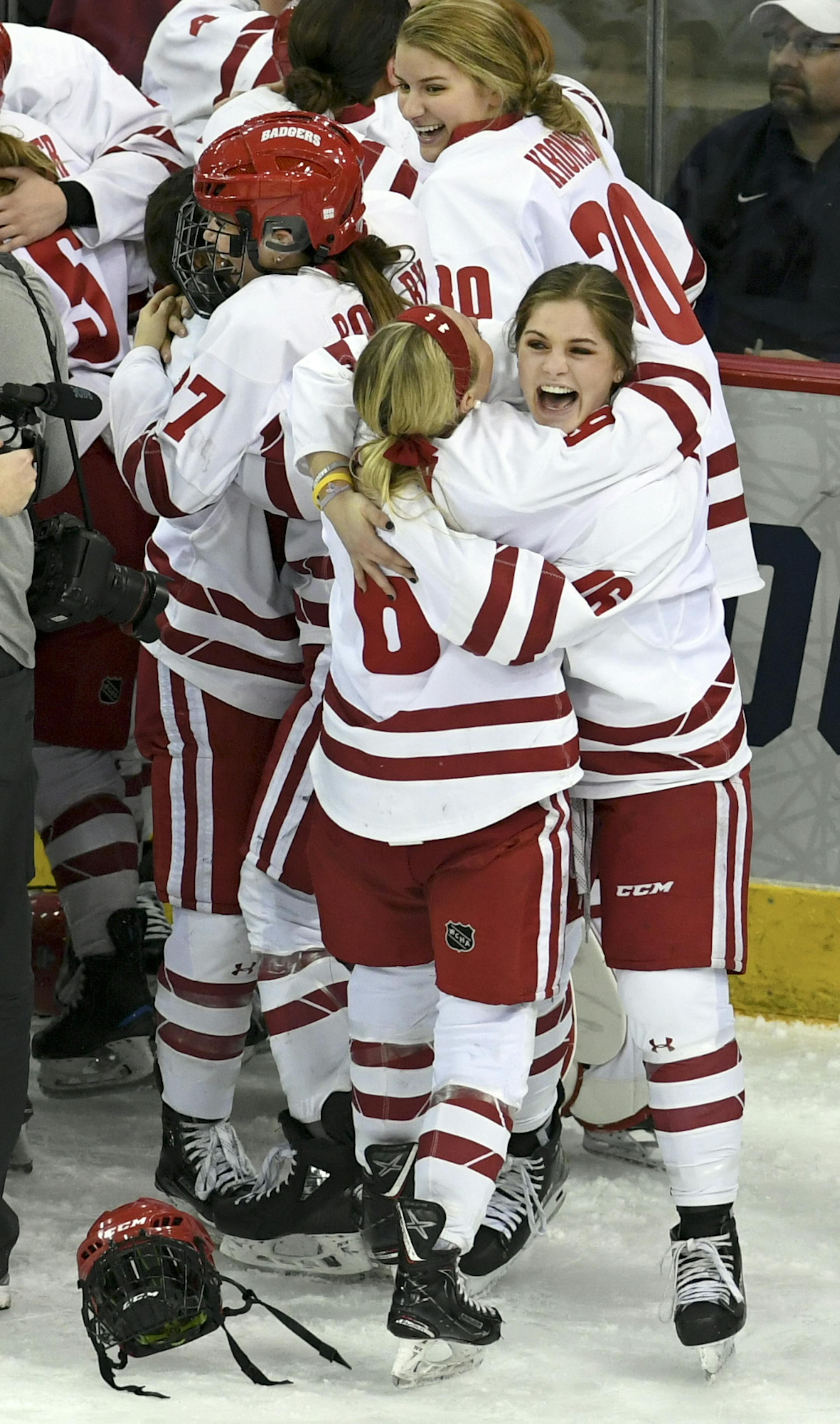 Wisconsin players celebrate after defeating Minnesota 2-0 for the NCAA Division I women's Frozen Four hockey championship Sunday, March 24, 2019, in Hamden, Conn. (AP Photo/Stephen Dunn)